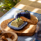 Wave mini ceramic butter dish in blue speckled ceramic with matching lid on olive wood board for mini ceramic butter use