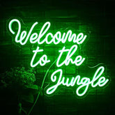 A glowing green led neon light sign reading welcome to the jungle ideal for wall decor and home entryway use