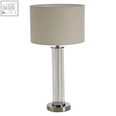 Westin table lamp with chrome finish, cylindrical ribbed glass base, and beige fabric shade for elegant lighting
