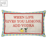 A rectangular lemons needlepoint cushion with cream center red border and light blue edges featuring yellow lemon motifs