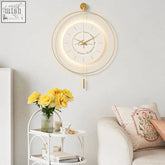 William simple style clock round is a modern circular wall clock with a gold toned frame and glowing led backlighting