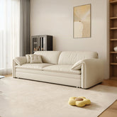 Cream-colored leather wilson single seater sofa bed with storage featuring clean lines and plush cushions