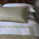 Beige quilted pillow with subtle diamond pattern and satin trim in windsor sable featuring high thread count fabric