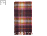 Winterton merino lambswool throw in burgundy with a cozy woven plaid pattern in pink purple orange and cream with fringe