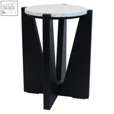 Black geometric side table with a white speckled travertine top and a black acacia wood frame