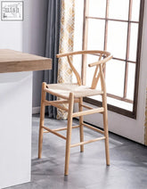 Light wooden y shaped back wishbone bar stool with woven natural fiber seat bar stool black ash