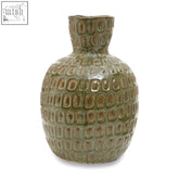 Yana large vase green ceramic with a rounded body narrow neck and textured repeating oval pattern