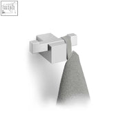 Modern silver-toned zack carvo stainless steel double towel hook holding a textured gray towel with blocky design