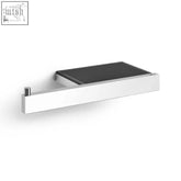 Modern white wall-mounted towel rack with black ribbed surface paired with zack linea polished stainless steel toilet roll holder with shelf