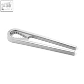 Silver brushed stainless steel noza nutcracker with sleek minimalist design and serrated jaws for cracking nuts