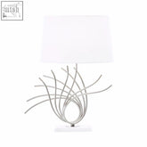 Zaha brushed chrome spoke table lamp with silver metallic base and white linen shade featuring an abstract design