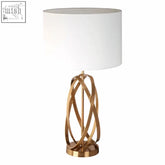 Zaina gold cross table lamp with gold-toned metal cross base and white cylindrical shade perfect for cozy lighting