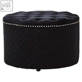 Zamora round black velvet ottoman with diamond-quilted upholstery and silver nailhead trim in black velvet