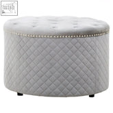 Round grey velvet ottoman with diamond quilted upholstery and decorative beaded trim perfect for stylish seating