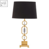 Zana gold and crystal table lamp with gold tone, black drum shade, and crystal geometric accents for elegant lighting