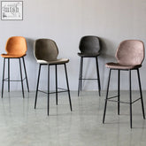 Four zavier bar stools with upholstered seats in orange gray black dusty rose and painted steel dimensions legs