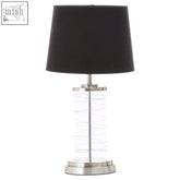 Zola glass cylinder table lamp with black linen shade and clear glass base with silver metallic accents