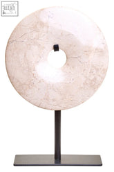 Extra small cream marble disc sculpture with subtle veining on black metal stand by zoro, 15cm diameter