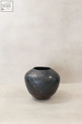 Dark ceramic zulu pot from south africa with geometric triangular etchings perfect for decor or gifts