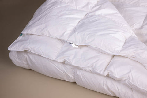 White quilted 10.5 tog all seasons duvet with soft plush texture and goose feather filling for cozy warmth
