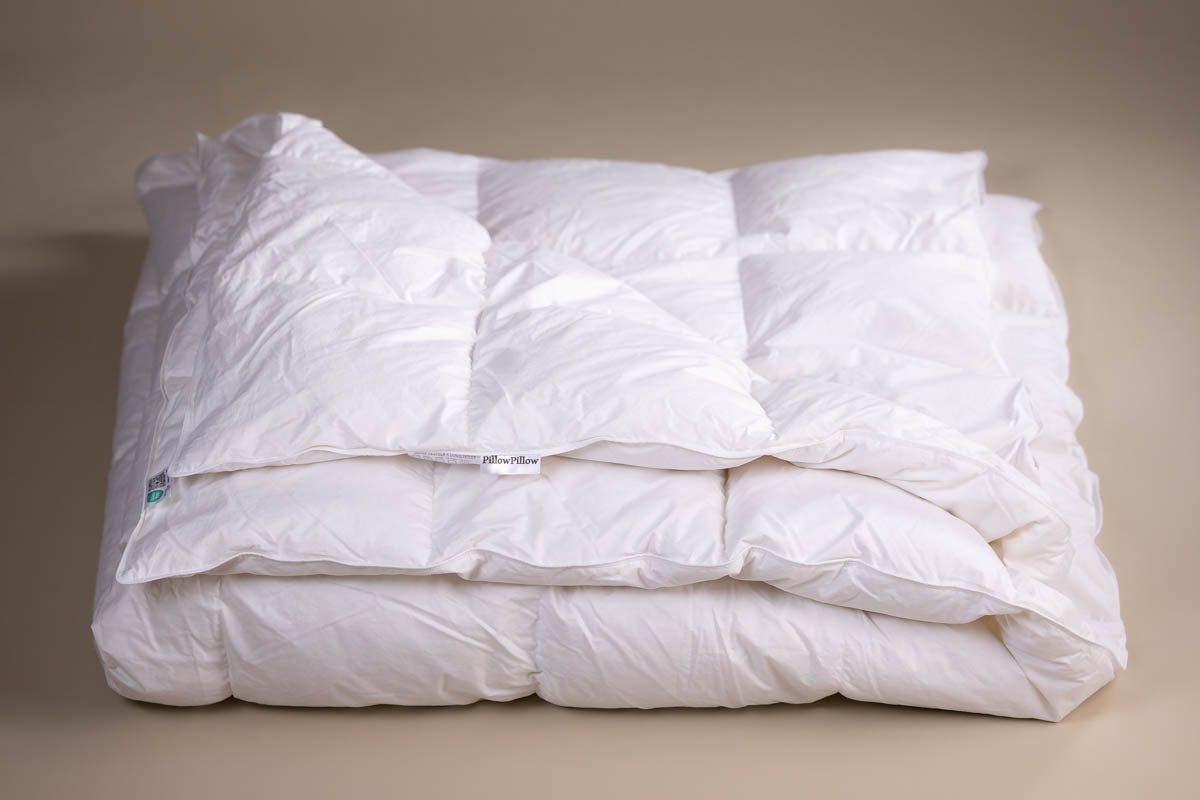 White quilted 10.5 tog all seasons duvet with soft plush texture and goose feather fill for cozy warmth