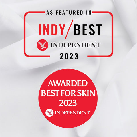 Red award seals from independent magazine on 100% organic bamboo flat bed sheets highlighting best for skin 2023