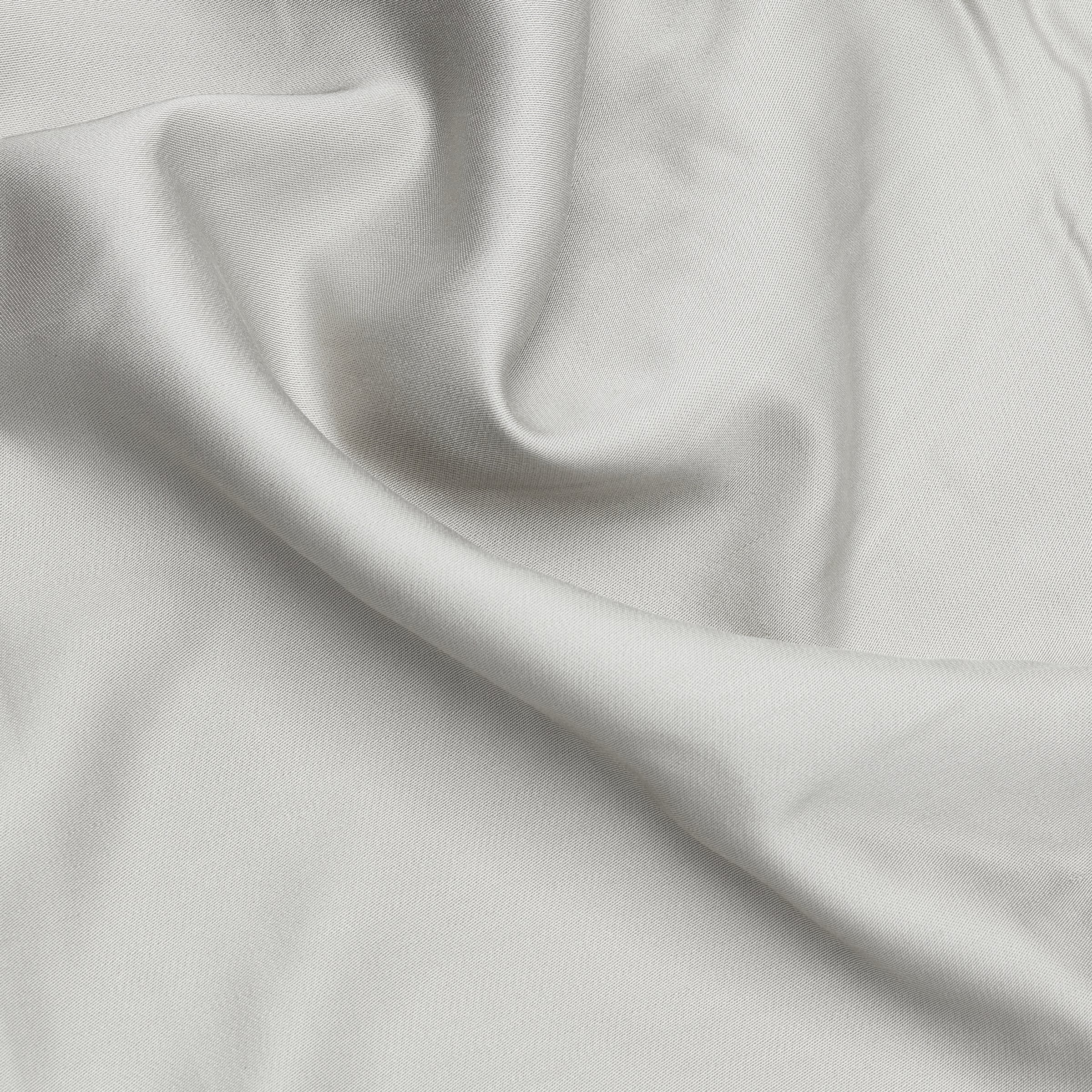 A smooth light gray 100% organic bamboo silk duvet cover with subtle sheen and fine woven texture