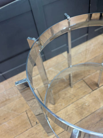Chrome finished metal frame with clear glass shelves on a 1970s round glass top dining table by richard young merrow associates
