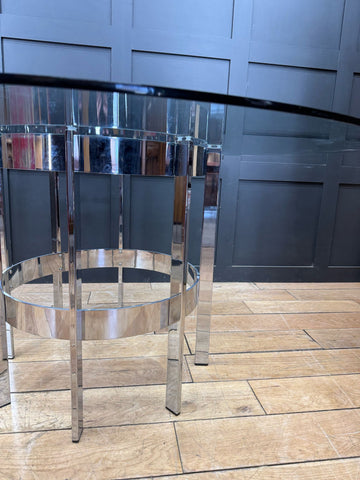 Chrome-finished metal bar stool with circular glass top and sleek legs for 1970s merrow associates dining table by richard young