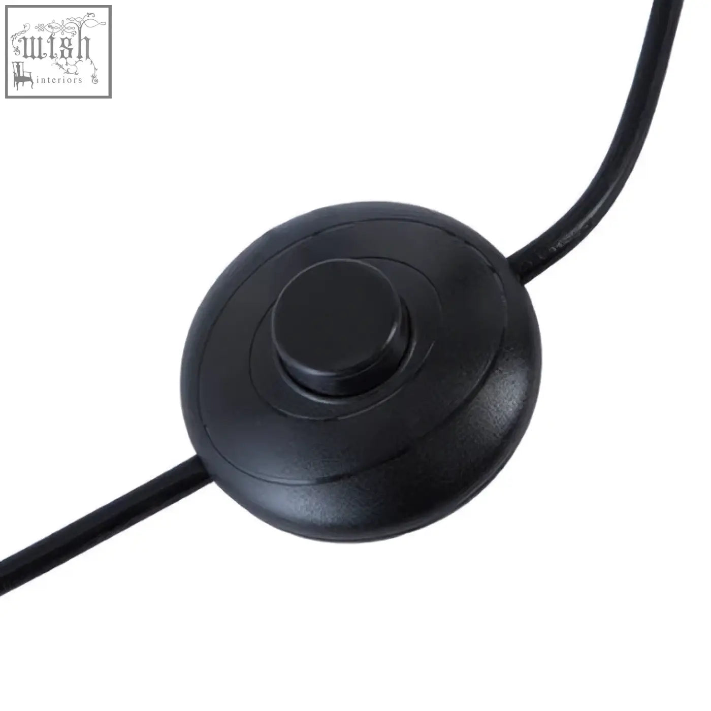 Black circular power switch with textured button attached to cable for height adjustable revolution tripod floor lamp