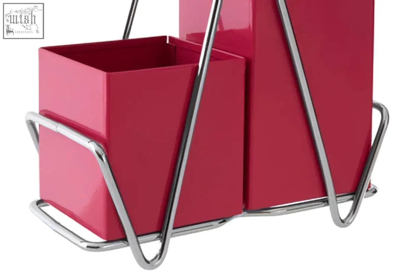 A sleek hot pink cutlery caddy with two compartments and chrome handles perfect for organizing kitchen utensils
