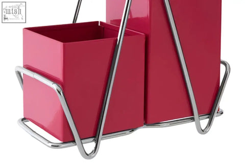 A sleek hot pink cutlery caddy with two compartments and chrome handles perfect for organizing kitchen utensils