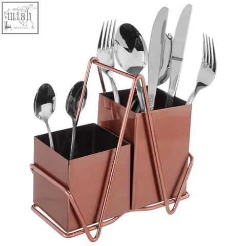 Rose gold cutlery caddy with two square compartments holding silverware in a sleek metal utensil holder