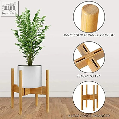 Minimalist bamboo plant stand with four slender legs and cross-braced base holding a white ceramic flower pot holder