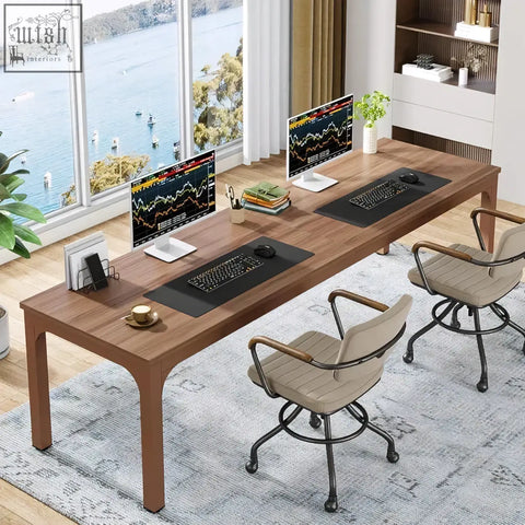 Long desk with two monitors and ergonomic chairs in a 200cm modern extra long walnut home office workstation