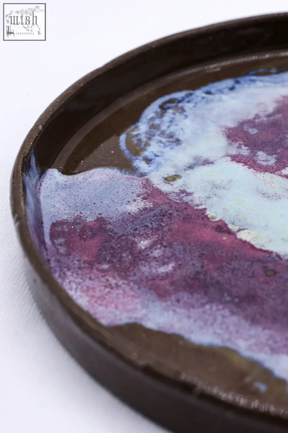A 23 cm smoked grey large stoneware handmade ceramic dinner plate with a dark brown rim and purple pink glaze design