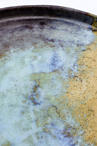 A 27 cm shoreline stoneware handmade ceramic dinner plate with glossy blue green and amber mottled glaze from ribera handmade ceramics