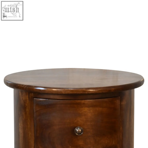 Rich brown wooden nightstand with curved top and single drawer knob made from solid mango wood chestnut drum style