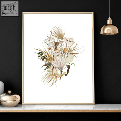 A set of 3 framed wall art with botanical art prints featuring dried flowers in beige cream and muted green tones above bed