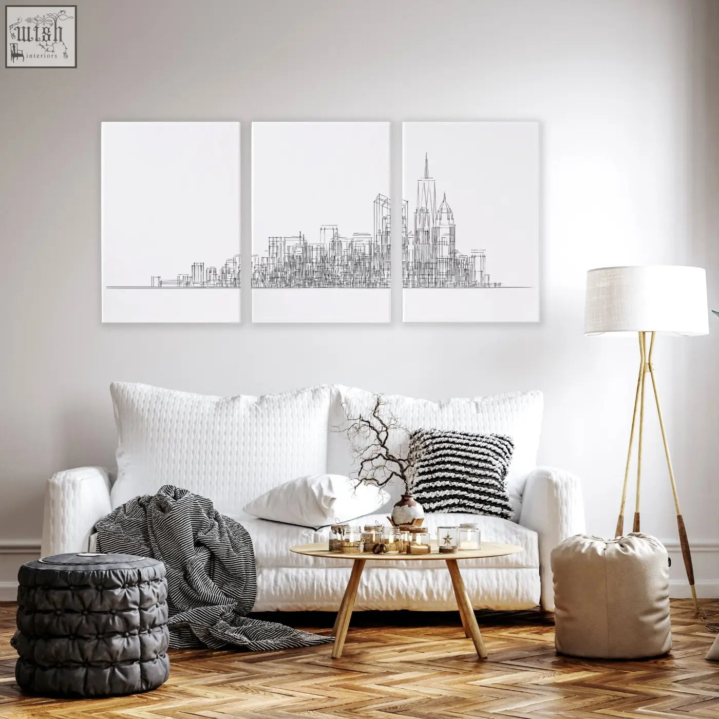 White sofa with textured fabric and matching throw pillows in living room with new york skyline wall art prints