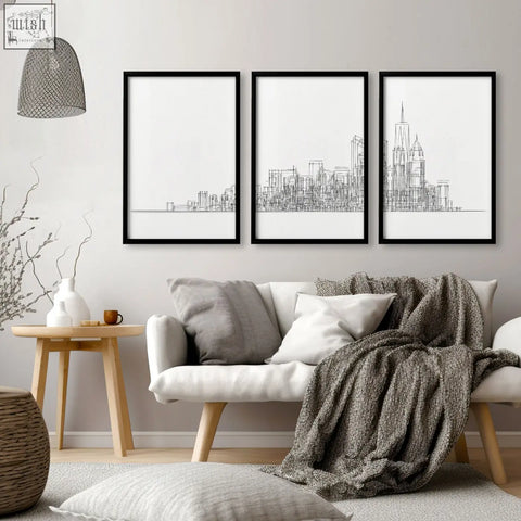 Three black-framed minimalist line art cityscape wall art prints for living room inspired by new york skyline