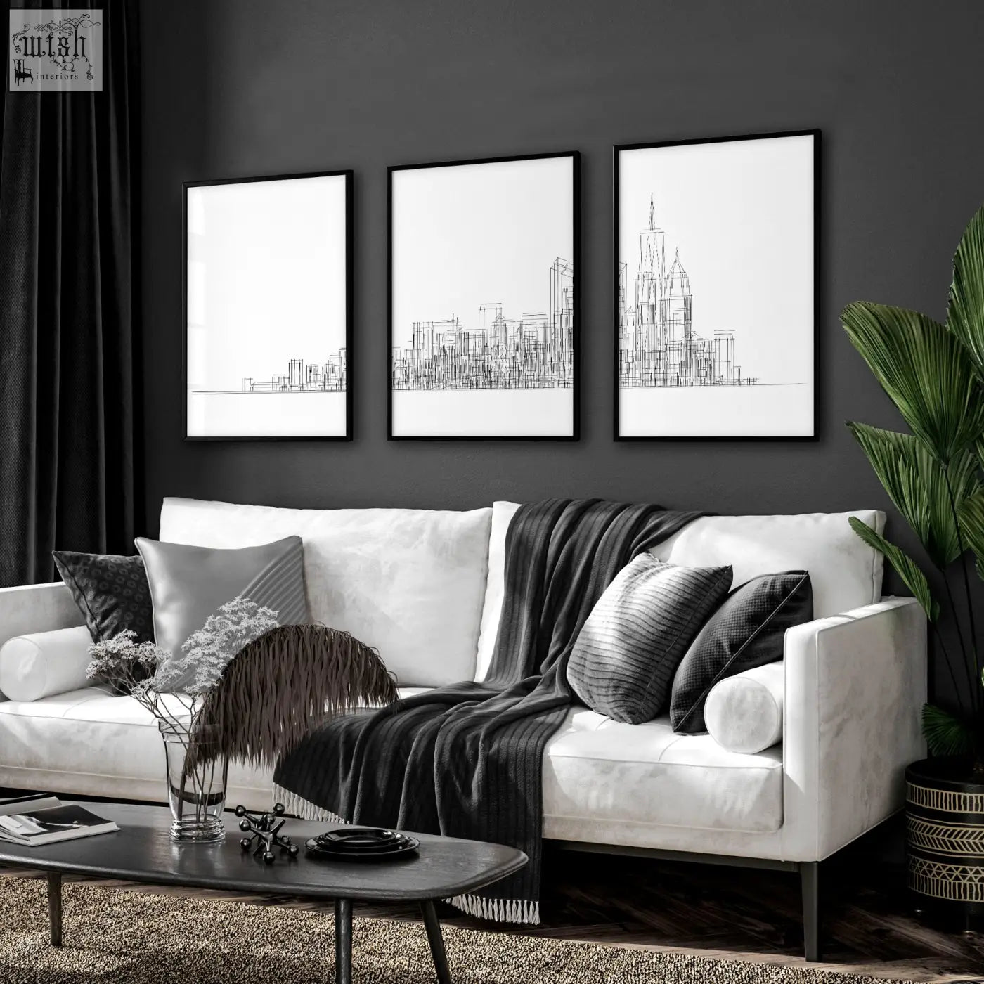 Three black and white new york skyline line art wall art prints in frames on a dark gray wall for living room decor