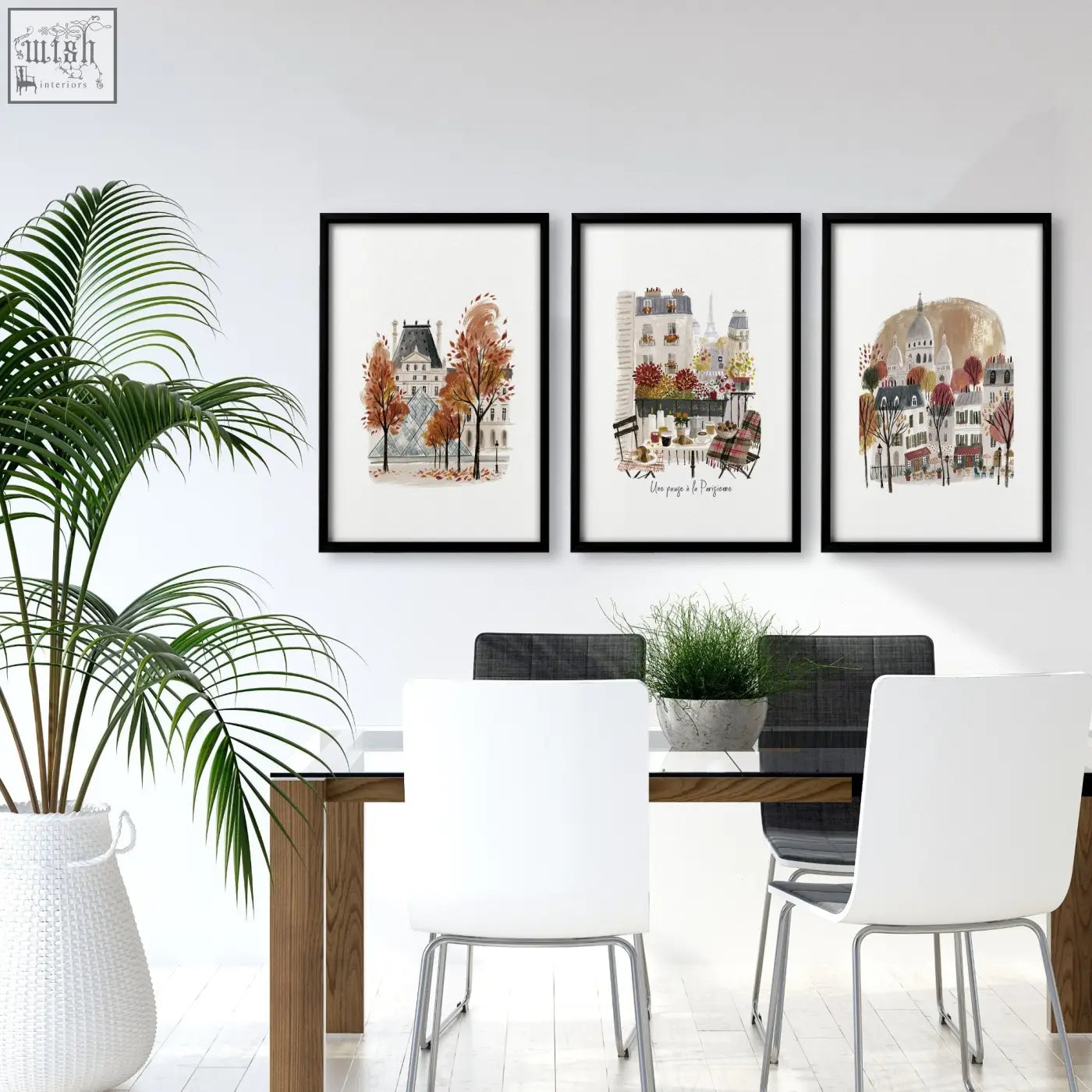 Three framed watercolor art prints of autumn paris scenes featuring eiffel tower above a dining room table
