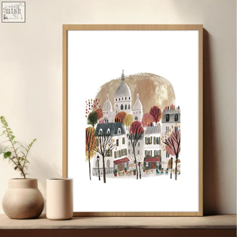 A framed watercolor art print of a parisian street with autumn trees and sacré-cœur for dining room decor