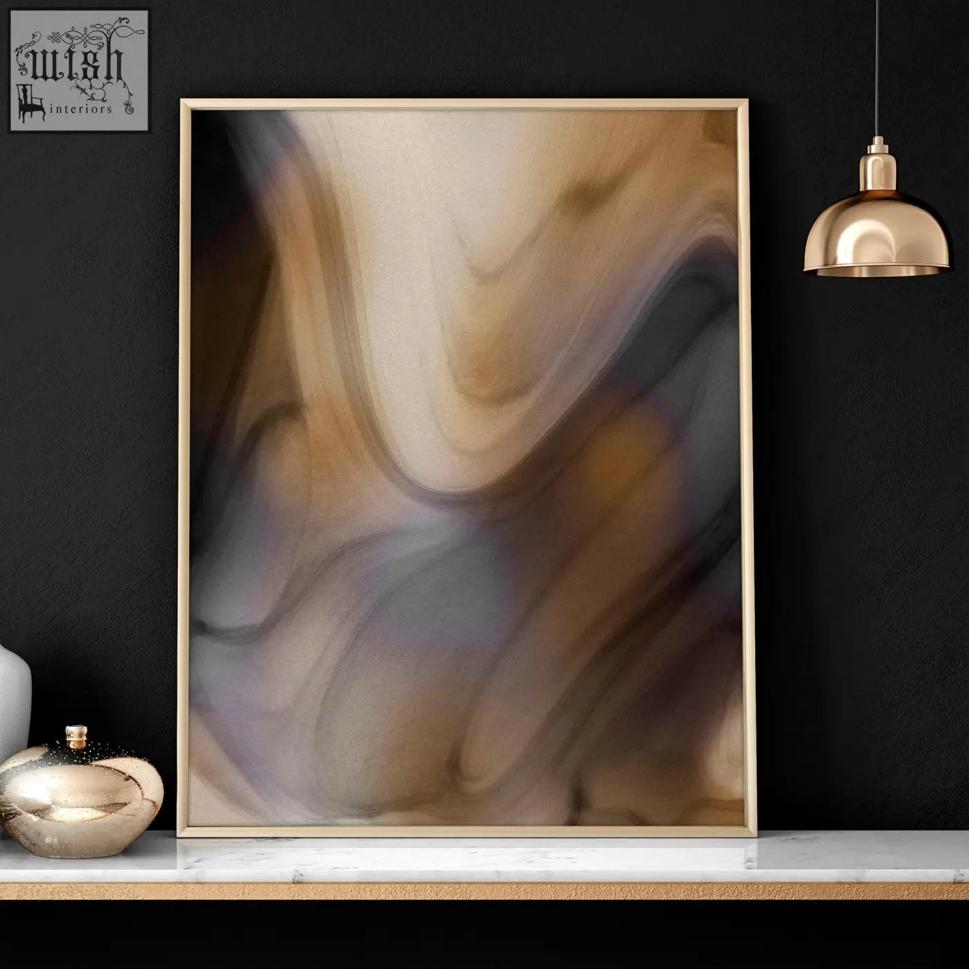 A framed abstract wall art print in beige brown and gray hues with a minimalist gold frame from a contemporary wall art set