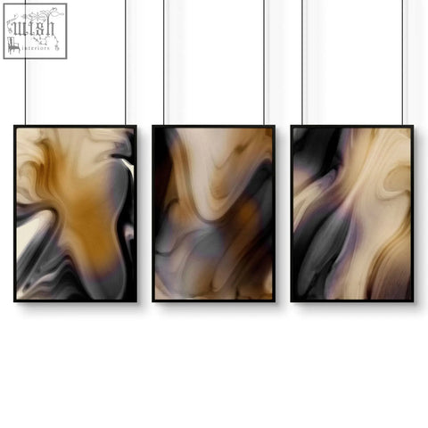 Three black-framed contemporary wall art prints with swirling beige brown gray and subtle purple patterns in a wall art set