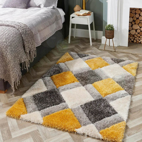A plush ochre geometric shaggy area rug with a 3d patchwork design in mustard yellow gray and cream colors