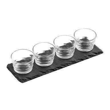 Set of four clear ribbed glass bowls arranged on a black slate tray perfect for serving shots or snacks