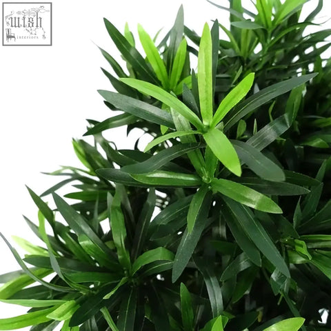 A 40cm podocarpus bush artificial plant with lush long slender emerald and forest green leaves perfect for decor