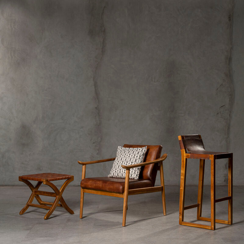 Brown woven leather armchair with wooden frame and patterned cushion from kendari brown woven collection
